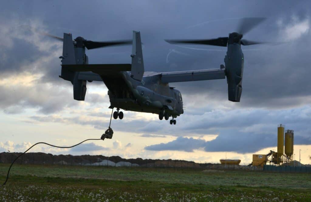An Estonian Special Operations operator is hoisted to US Air Force CV-22 Osprey during extraction training