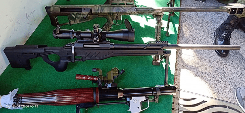 Chinese rifle on table with other weapons.